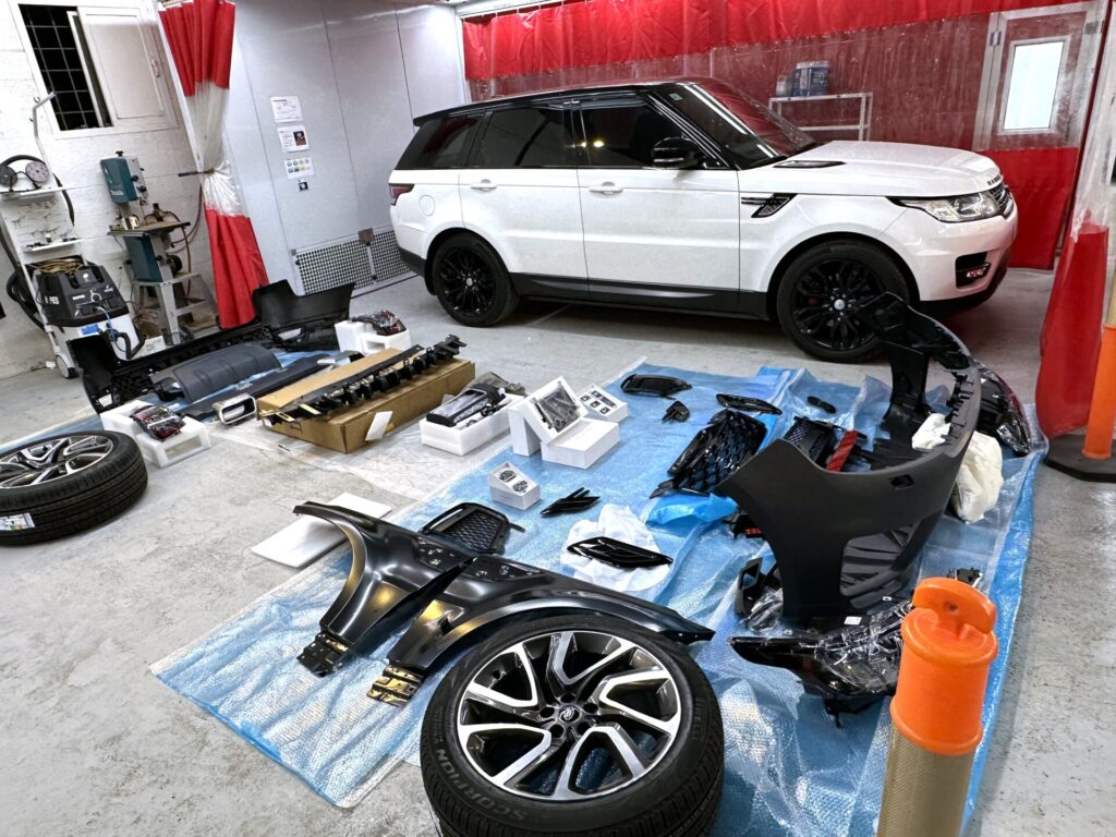 Vehicle before body kit installation — kit components laid out